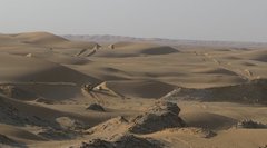 Oman_2009_Dozer_in_dunes_near_jebel_1.jpg